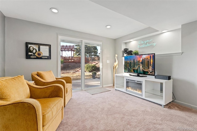 living area featuring carpet, baseboards, and recessed lighting