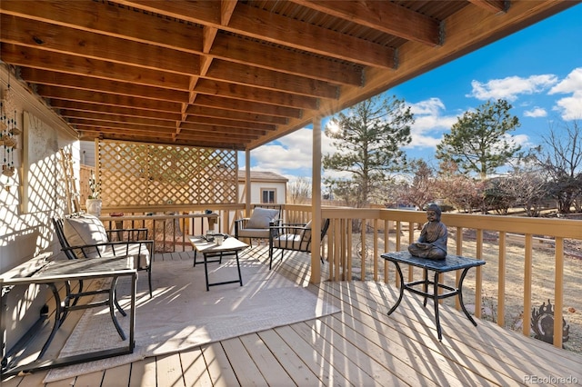 wooden terrace with outdoor lounge area