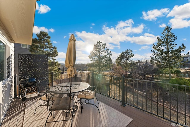 wooden deck with outdoor dining area