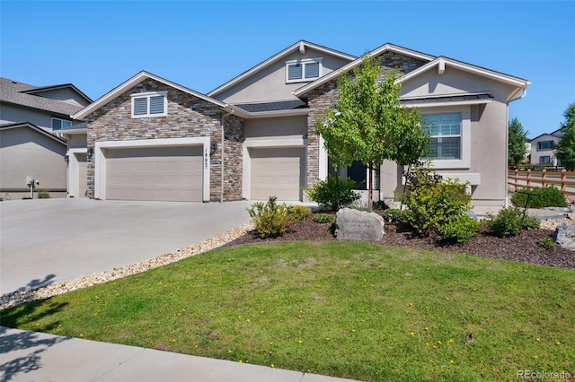 craftsman-style house featuring a front lawn, stone siding, stucco siding, concrete driveway, and an attached garage