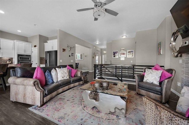 living room with a ceiling fan, baseboards, recessed lighting, visible vents, and dark wood-style floors