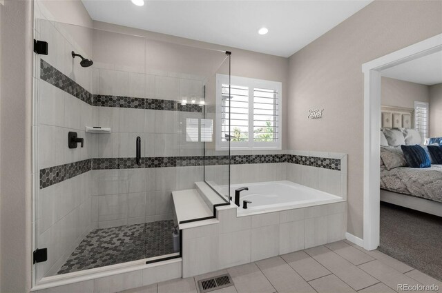 full bathroom featuring tile patterned flooring, ensuite bath, a shower stall, visible vents, and a bath