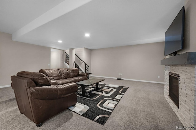 living area featuring light colored carpet, stairway, baseboards, a glass covered fireplace, and recessed lighting
