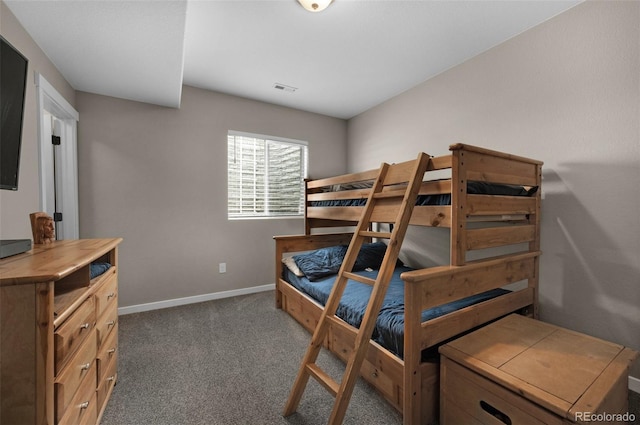 bedroom featuring carpet floors, baseboards, and visible vents