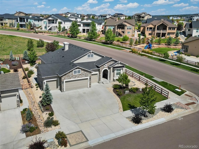 birds eye view of property with a residential view