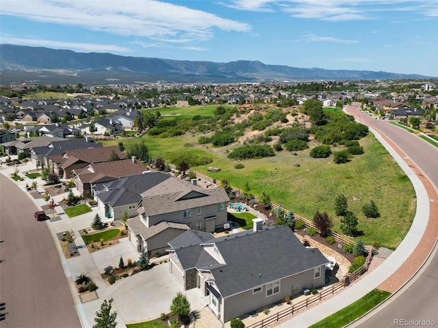 drone / aerial view featuring a mountain view and a residential view