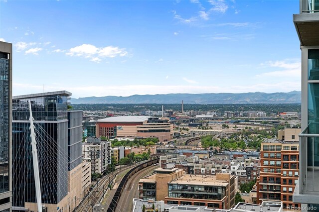 property's view of city with a mountain view