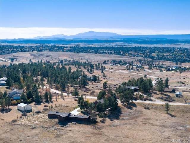 drone / aerial view featuring a mountain view