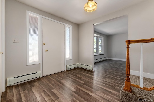 foyer with baseboard heating and dark hardwood / wood-style floors