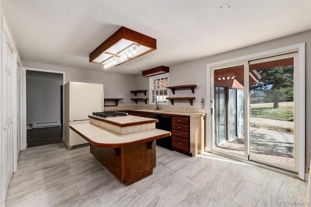 kitchen with dishwasher, baseboard heating, stainless steel gas stovetop, a breakfast bar, and white refrigerator