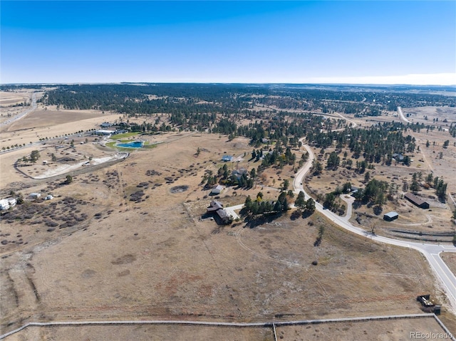 birds eye view of property with a rural view