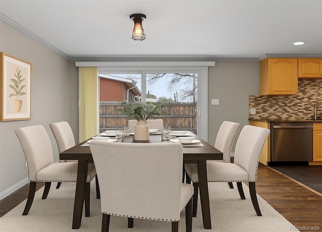 1996 S Dexter St, Denver, CO 80222 - dining area with dark wood finished floors, crown molding, and recessed lighting