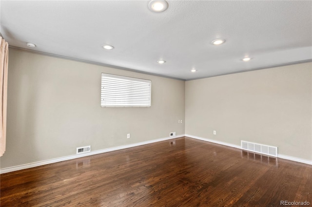 1996 S Dexter St, Denver, CO 80222 - spare room featuring ornamental molding, recessed lighting, and wood finished floors