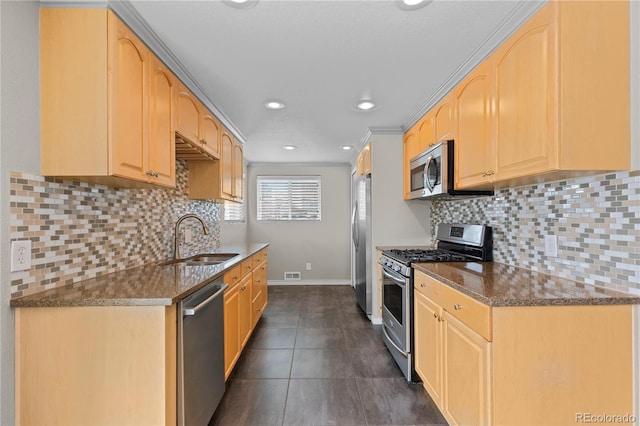 1996 S Dexter St, Denver, CO 80222 - kitchen with appliances with stainless steel finishes, light brown cabinets, recessed lighting, and dark stone countertops
