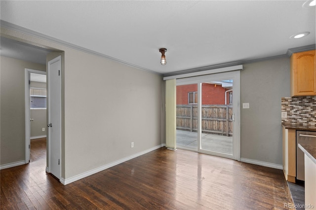 1996 S Dexter St, Denver, CO 80222 - unfurnished dining area featuring ornamental molding, wood finished floors, plenty of natural light, and recessed lighting