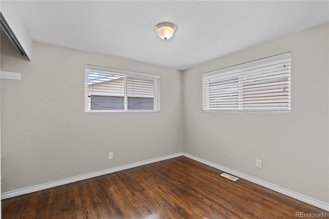 1996 S Dexter St, Denver, CO 80222 - empty room with baseboards and dark wood-style flooring