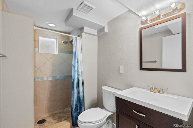 1996 S Dexter St, Denver, CO 80222 - full bath with vanity, tiled shower, and a textured wall