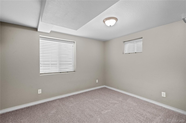 1996 S Dexter St, Denver, CO 80222 - carpeted spare room with healthy amount of natural light and a textured ceiling