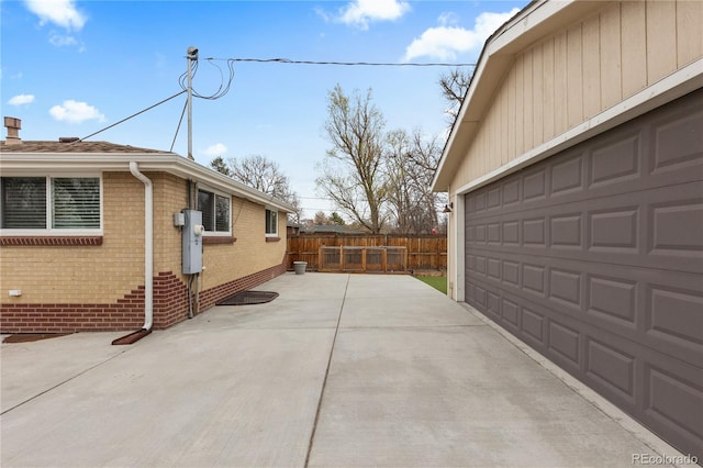 1996 S Dexter St, Denver, CO 80222 - view of side of home featuring brick siding and a garage