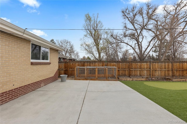 1996 S Dexter St, Denver, CO 80222 - fenced backyard featuring a putting green and a patio area