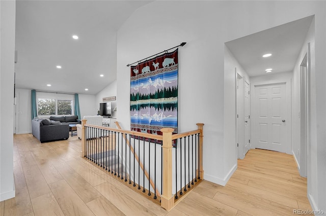 525 Badger Creek Dr, Brighton, CO 80601 - hallway featuring an upstairs landing, hardwood / wood-style floors, recessed lighting, and vaulted ceiling