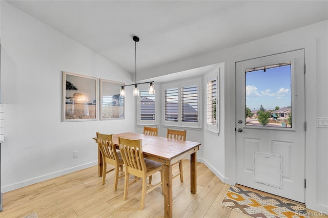 525 Badger Creek Dr, Brighton, CO 80601 - dining area with light wood-type flooring and lofted ceiling