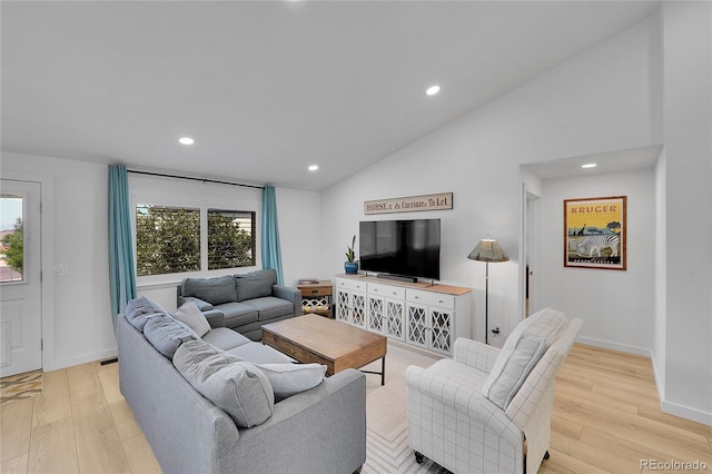 525 Badger Creek Dr, Brighton, CO 80601 - living area with light wood-style floors, healthy amount of natural light, recessed lighting, and vaulted ceiling