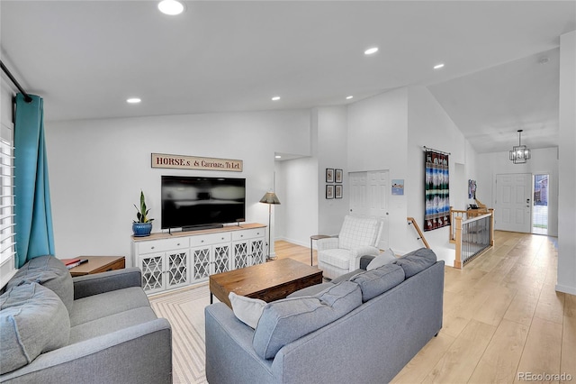 525 Badger Creek Dr, Brighton, CO 80601 - living room with light wood-type flooring, recessed lighting, and high vaulted ceiling