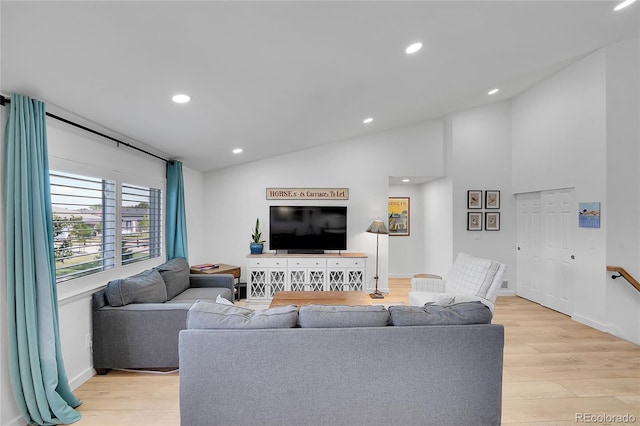 525 Badger Creek Dr, Brighton, CO 80601 - living area with vaulted ceiling, light wood-type flooring, and recessed lighting
