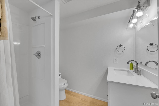525 Badger Creek Dr, Brighton, CO 80601 - bathroom with vanity, a shower with curtain, and wood finished floors