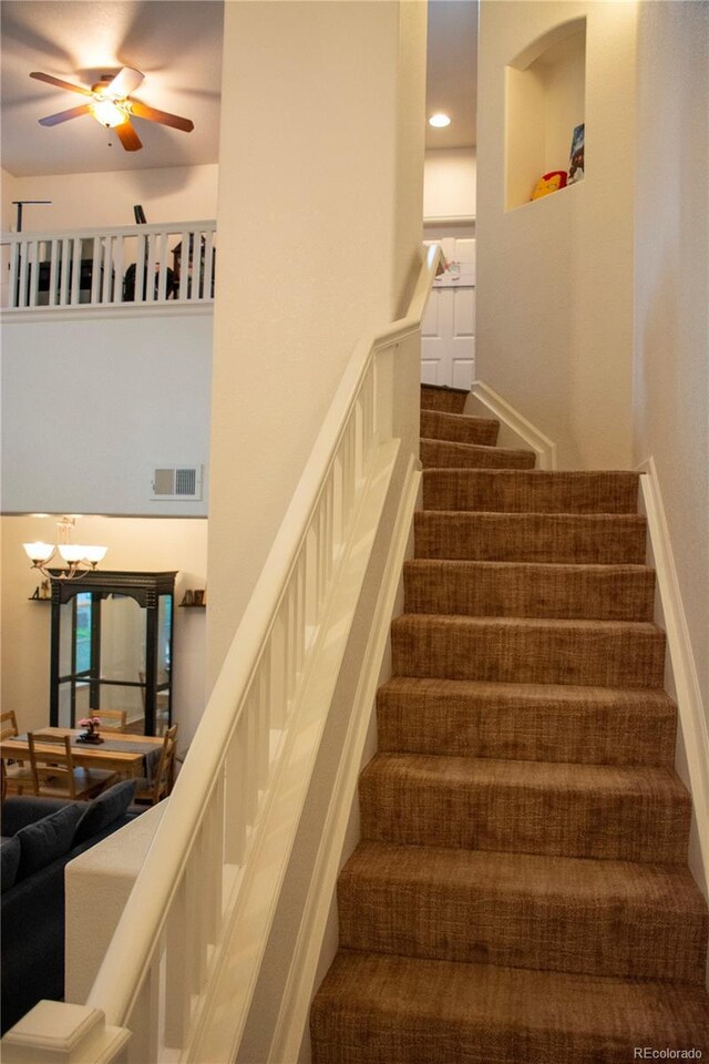 staircase with ceiling fan