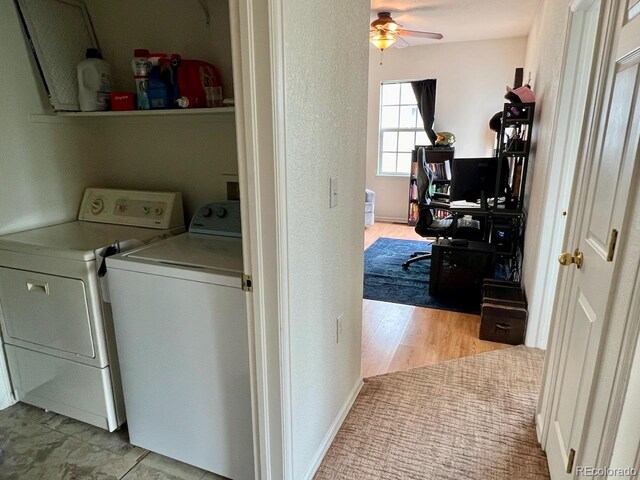 clothes washing area with light hardwood / wood-style floors, ceiling fan, and separate washer and dryer