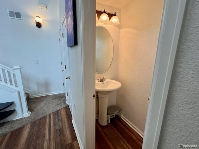 bathroom with wood-type flooring