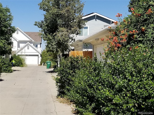 8802 E 24th Pl Unit 101, Denver, CO 80238 - view of front of home featuring a garage and concrete driveway