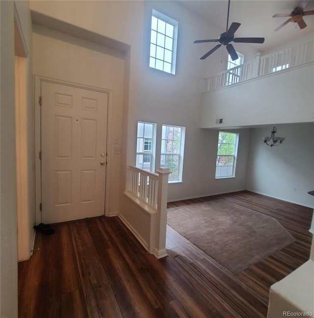 8802 E 24th Pl Unit 101, Denver, CO 80238 - foyer entrance featuring dark wood-style floors, ceiling fan, a towering ceiling, and baseboards