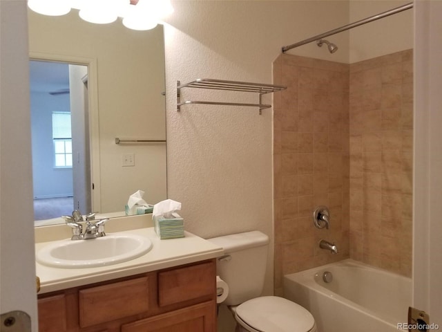 8802 E 24th Pl Unit 101, Denver, CO 80238 - bathroom with shower / washtub combination, vanity, a textured wall, and toilet