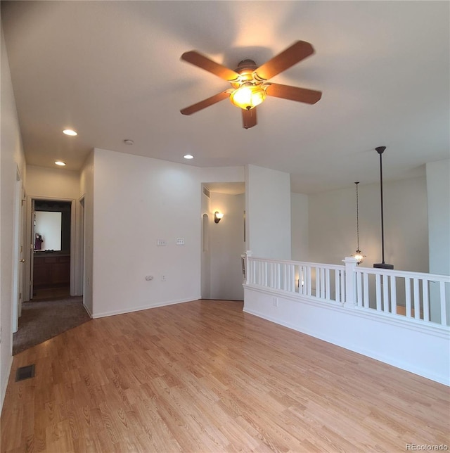 8802 E 24th Pl Unit 101, Denver, CO 80238 - spare room featuring a ceiling fan, light wood-style flooring, and recessed lighting