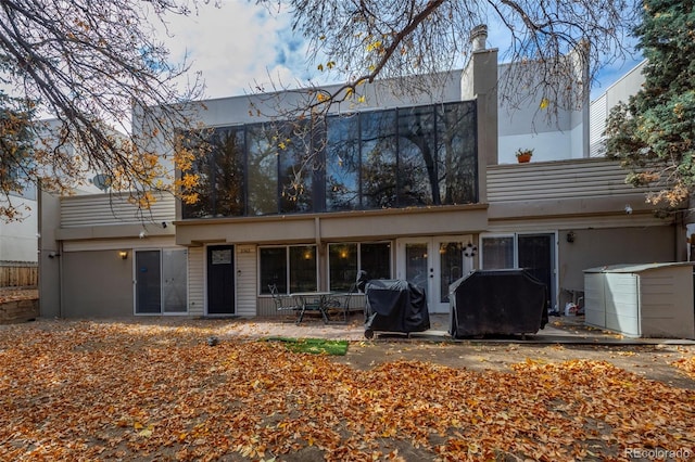 back of house with a patio area