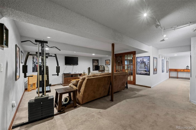 living room with french doors, light carpet, and a textured ceiling