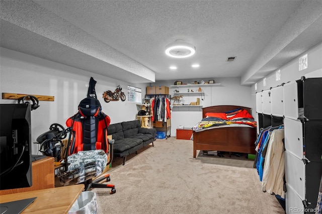 carpeted bedroom featuring a textured ceiling