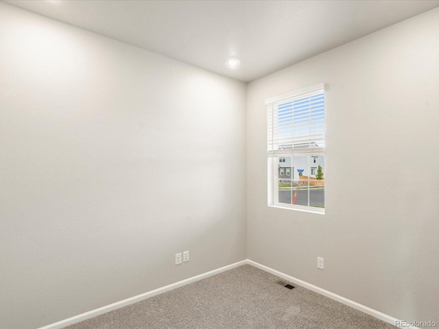 empty room featuring carpet flooring