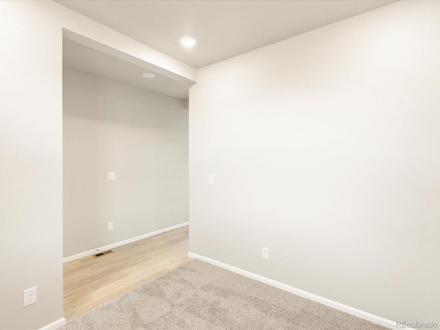 unfurnished room featuring light hardwood / wood-style flooring