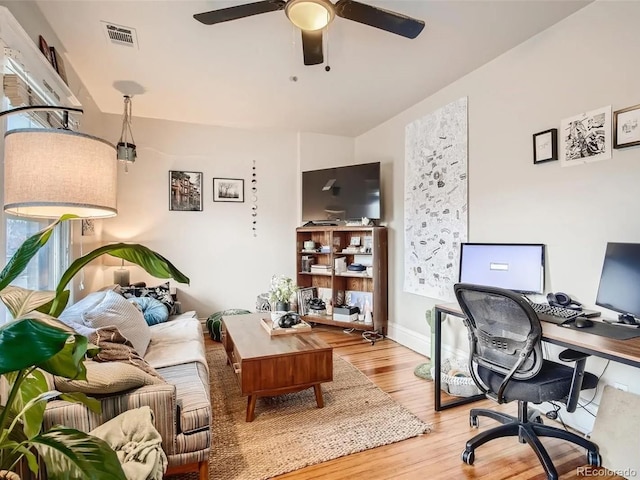 home office with ceiling fan and wood-type flooring