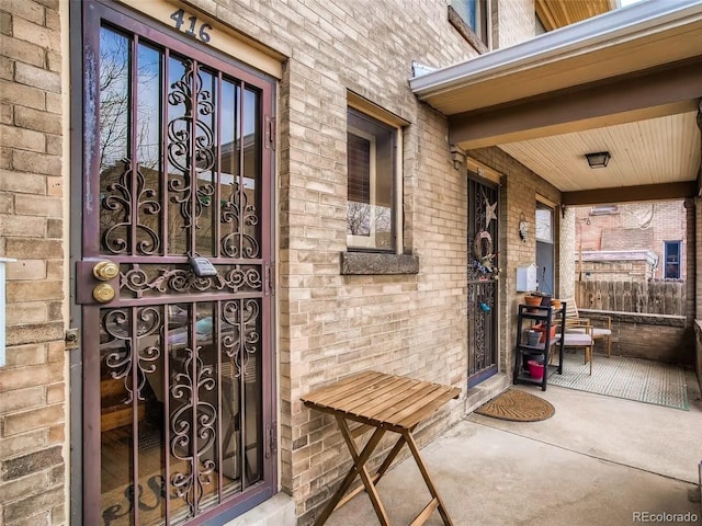 doorway to property with a porch