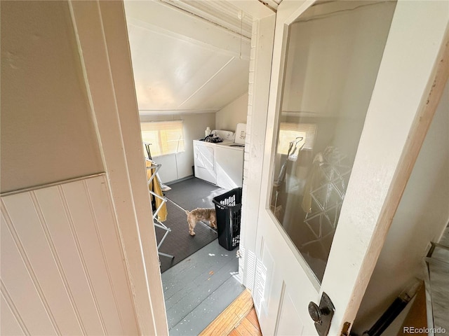 bathroom with lofted ceiling and separate washer and dryer