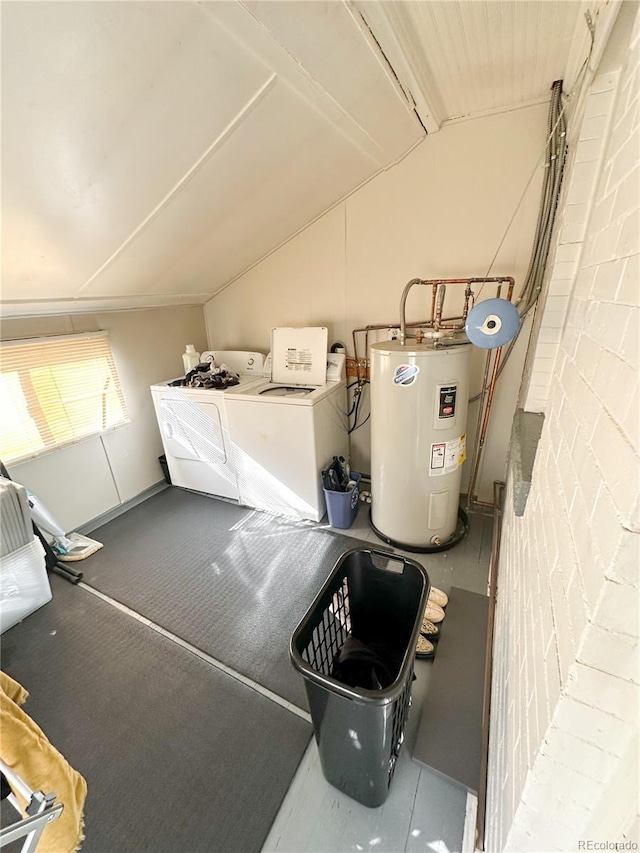 utility room with washer and clothes dryer and electric water heater