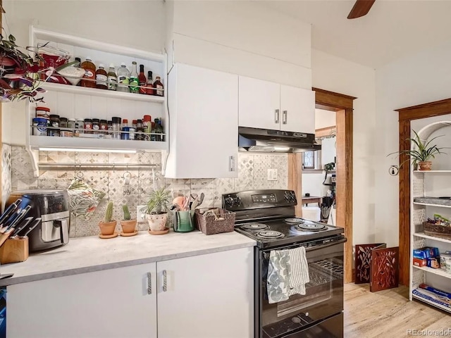 kitchen featuring black range with electric cooktop, light hardwood / wood-style flooring, white cabinetry, and tasteful backsplash