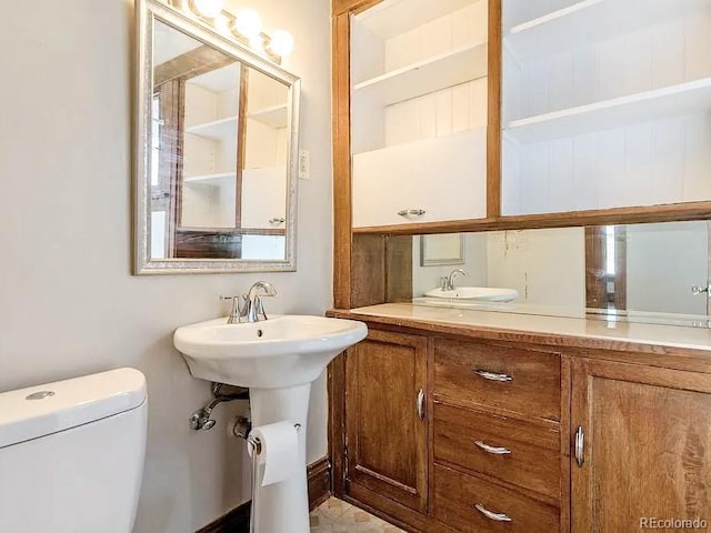 bathroom featuring toilet and sink