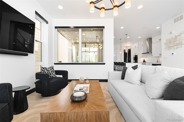 21418 E 61st Dr, Aurora, CO 80019 - living area with a chandelier, recessed lighting, and baseboards