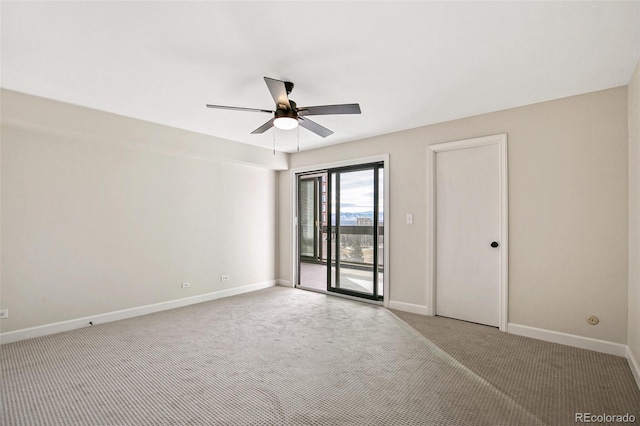 empty room with ceiling fan and carpet floors